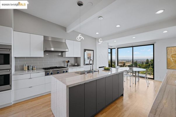 Dining room, Interior, Kitchen, Pendant Lights, Recessed Lighting, Stainless Steel Appliances, Wood Texture Flooring