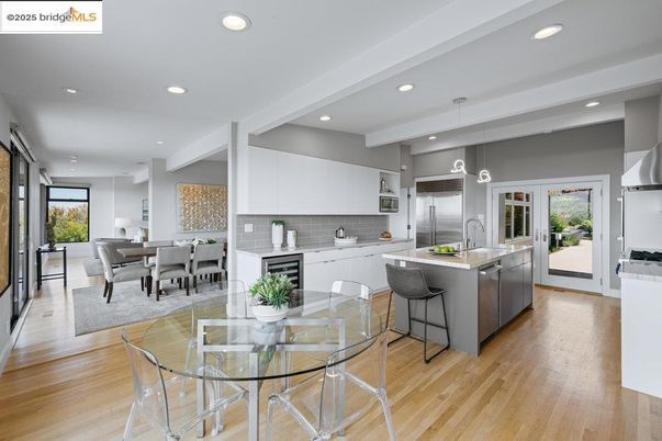 Dining room, Interior, Kitchen, Pendant Lights, Recessed Lighting, Stainless Steel Appliances, Wood Texture Flooring