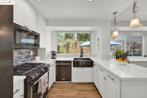 Interior, Kitchen, Pendant Lights, Recessed Lighting, Stainless Steel Appliances, Wood Texture Flooring
