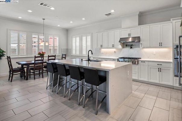 Dining room, Interior, Kitchen, Pendant Lights, Recessed Lighting, Stainless Steel Appliances, Wood Texture Flooring