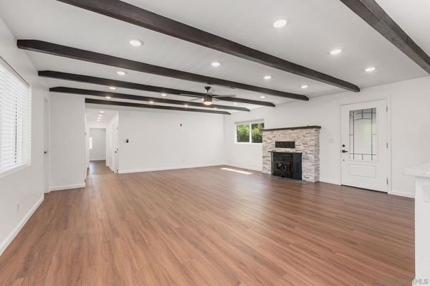 Empty room, Fireplace, Interior, Recessed Lighting, Stone Walls, Wooden Beams, Wood Texture Flooring