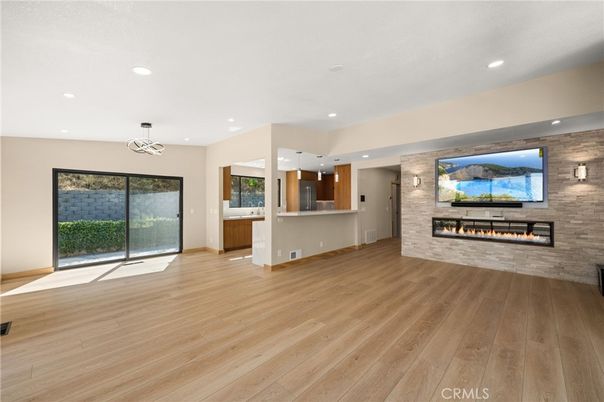 Empty room, Fireplace, Interior, Pendant Lights, Recessed Lighting, Stone Walls, Wood Texture Flooring