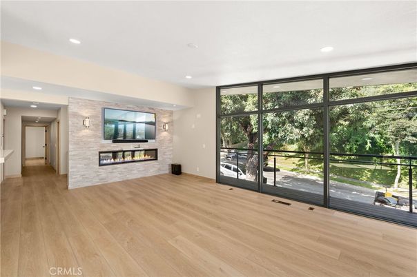 Empty room, Fireplace, Interior, Recessed Lighting, Stone Walls, Wood Texture Flooring