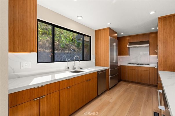Interior, Kitchen, Marble Walls, Recessed Lighting, Stainless Steel Appliances, Wood Texture Flooring