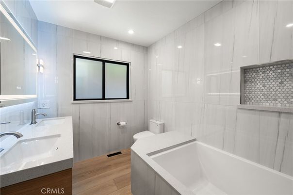 Bathroom, Dual Sink Vanities, Interior, Recessed Lighting, Wood Texture Flooring