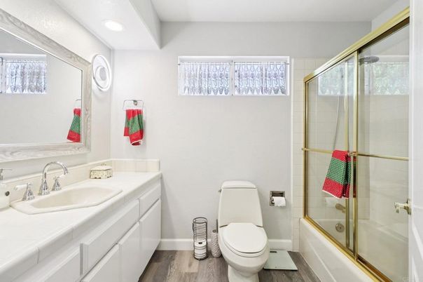 Bathroom, Glass Shower, Interior, Recessed Lighting, Tile Countertops, Wood Texture Flooring