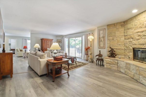 Fireplace, Interior, Living room, Recessed Lighting, Stone Walls, Wood Texture Flooring