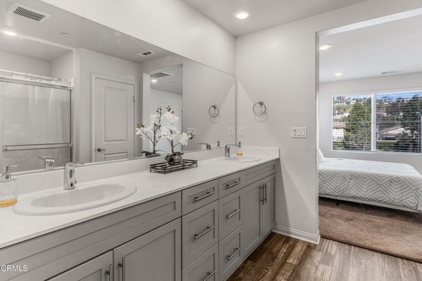 Bathroom, Dual Sink Vanities, Interior, Recessed Lighting, Wood Texture Flooring