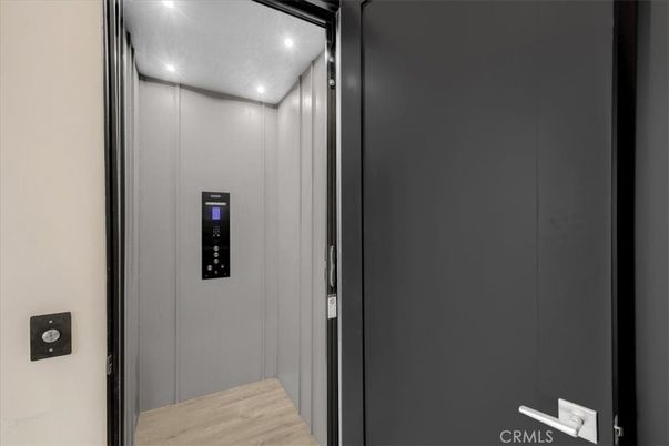 Elevator, Interior, Recessed Lighting, Wood Texture Flooring