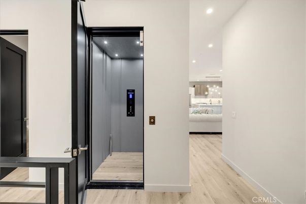 Elevator, Interior, Pendant Lights, Recessed Lighting, Wood Texture Flooring, Wooden Walls