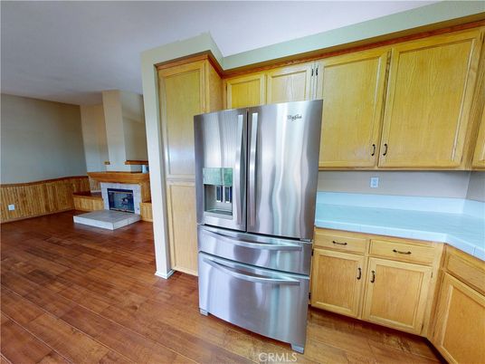 Fireplace, Interior, Kitchen, Stainless Steel Appliances, Wood Texture Flooring