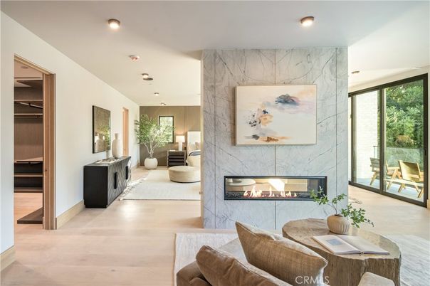 Fireplace, Interior, Living room, Marble Walls, Recessed Lighting, Wood Texture Flooring