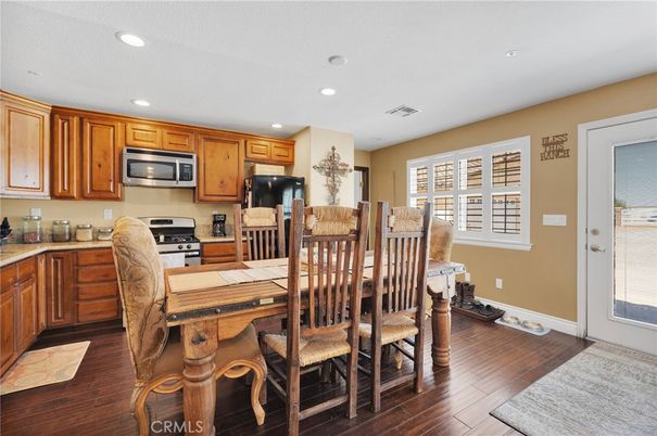 Dining room, Interior, Kitchen, Recessed Lighting, Stainless Steel Appliances, Wood Texture Flooring