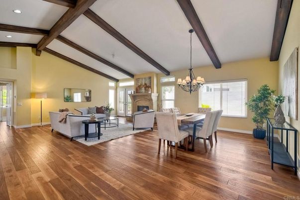 Chandelier, Dining room, Fireplace, Interior, Living room, Recessed Lighting, Wooden Beams, Wood Texture Flooring