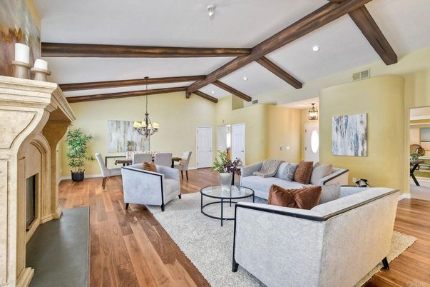 Chandelier, Dining room, Fireplace, Interior, Living room, Recessed Lighting, Wooden Beams, Wood Texture Flooring