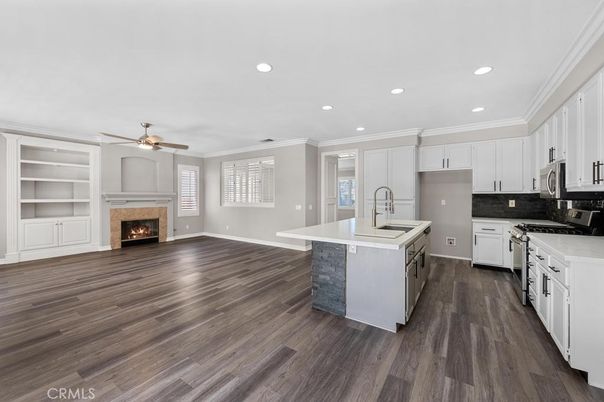 Empty room, Fireplace, Interior, Kitchen, Recessed Lighting, Wood Texture Flooring