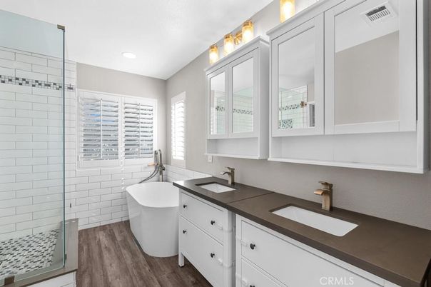 Bathroom, Dual Sink Vanities, Free Standing Baths, Interior, Recessed Lighting, Wood Texture Flooring