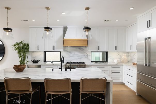 Interior, Kitchen, Marble Walls, Pendant Lights, Recessed Lighting, Stainless Steel Appliances, Wood Texture Flooring