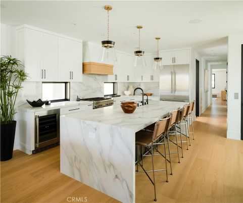 Interior, Kitchen, Marble Walls, Pendant Lights, Recessed Lighting, Stainless Steel Appliances, Wood Texture Flooring