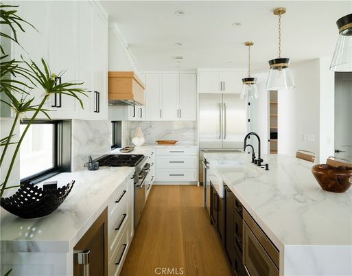 Interior, Kitchen, Marble Walls, Pendant Lights, Recessed Lighting, Stainless Steel Appliances, Wood Texture Flooring