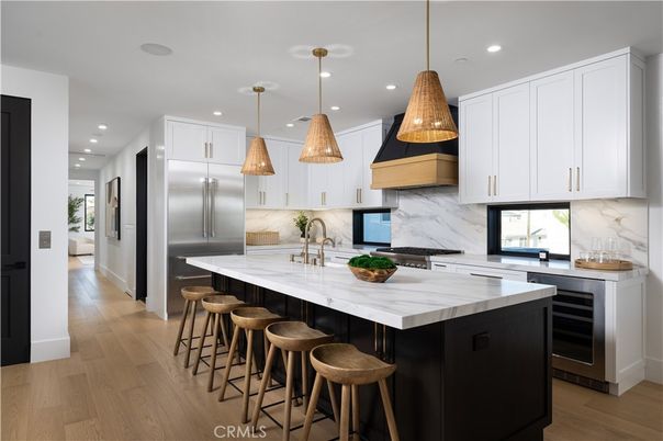 Interior, Kitchen, Marble Walls, Pendant Lights, Recessed Lighting, Stainless Steel Appliances, Wood Texture Flooring