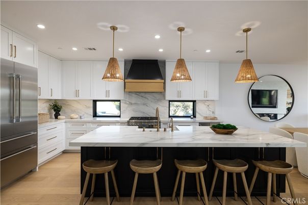 Interior, Kitchen, Marble Walls, Pendant Lights, Recessed Lighting, Stainless Steel Appliances, Wood Texture Flooring