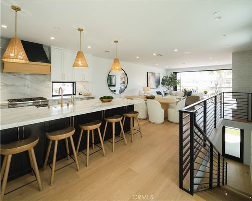 Dining room, Interior, Kitchen, Marble Walls, Pendant Lights, Recessed Lighting, Stainless Steel Appliances, Wood Texture Flooring
