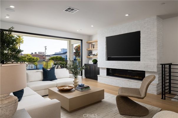 Fireplace, Interior, Living room, Recessed Lighting, Stone Walls, Wood Texture Flooring