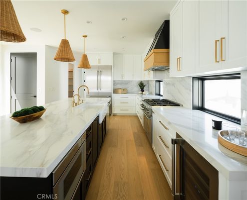 Interior, Kitchen, Marble Walls, Pendant Lights, Recessed Lighting, Stainless Steel Appliances, Wood Texture Flooring