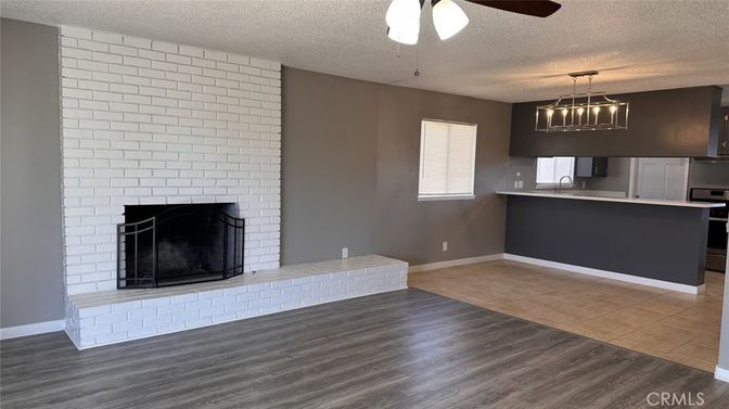 Empty room, Fireplace, Interior, Kitchen, Pendant Lights, Stone Walls, Wood Texture Flooring