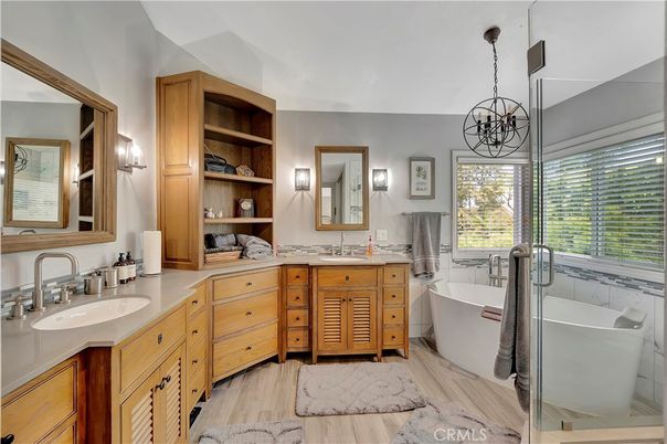 Bathroom, Chandelier, Dual Sink Vanities, Free Standing Baths, Interior, Pendant Lights, Wood Texture Flooring