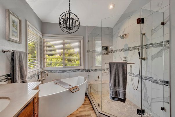 Bathroom, Free Standing Baths, Glass Shower, Interior, Marble Walls, Pendant Lights, Recessed Lighting, Wood Texture Flooring