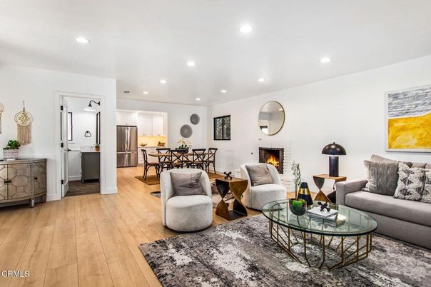 Dining room, Fireplace, Interior, Kitchen, Living room, Recessed Lighting, Stainless Steel Appliances, Wood Texture Flooring
