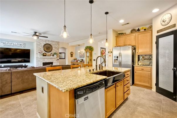 Fireplace, Interior, Kitchen, Living room, Pendant Lights, Recessed Lighting, Stainless Steel Appliances, Stone Walls