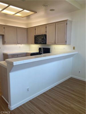 Interior, Kitchen, Tile Countertops, Wood Texture Flooring