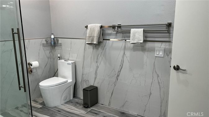 Bathroom, Glass Shower, Interior, Marble Walls, Wood Texture Flooring