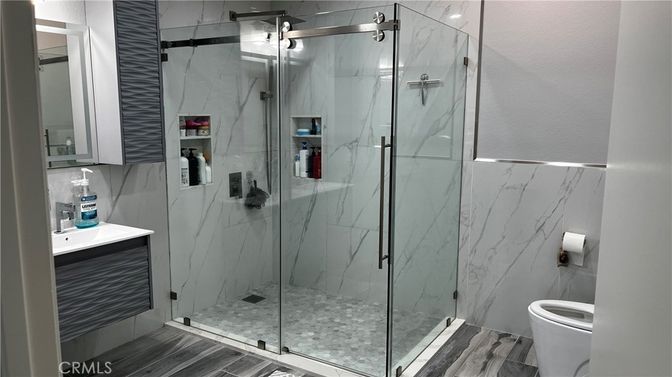 Bathroom, Glass Shower, Interior, Marble Walls, Wood Texture Flooring