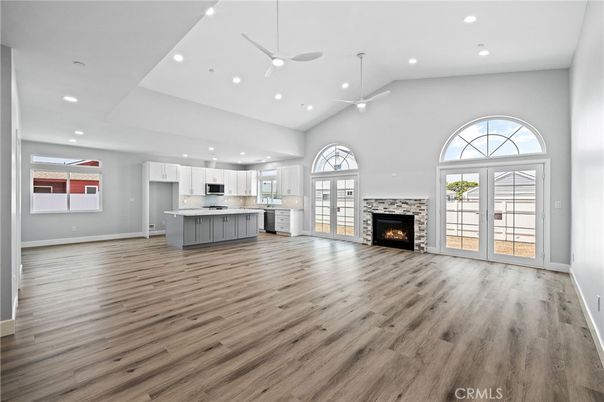 Empty room, Fireplace, Interior, Kitchen, Recessed Lighting, Wood Texture Flooring