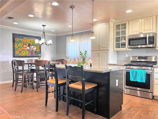 Dining room, Interior, Kitchen, Pendant Lights, Recessed Lighting, Stainless Steel Appliances, Wood Texture Flooring