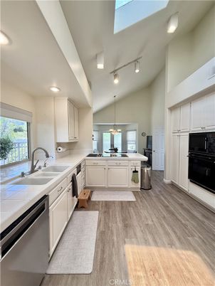 Interior, Kitchen, Pendant Lights, Recessed Lighting, Stainless Steel Appliances, Tile Countertops, Wood Texture Flooring