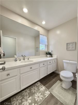 Bathroom, Dual Sink Vanities, Interior, Recessed Lighting, Tile Countertops, Wood Texture Flooring