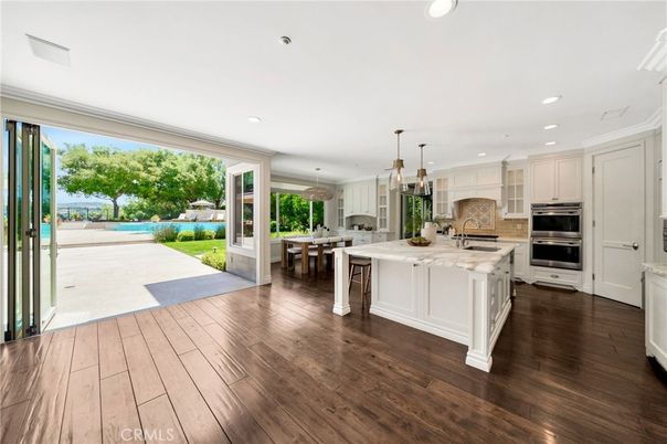 Dining room, Interior, Kitchen, Pendant Lights, Recessed Lighting, Stainless Steel Appliances, Wood Texture Flooring
