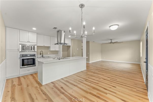 Chandelier, Interior, Kitchen, Recessed Lighting, Stainless Steel Appliances, Wood Texture Flooring