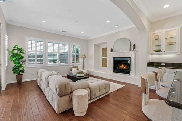 Dining room, Fireplace, Interior, Living room, Recessed Lighting, Wood Texture Flooring