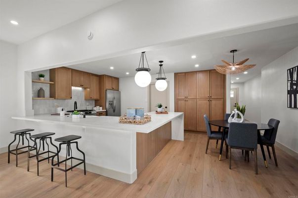 Dining room, Interior, Kitchen, Pendant Lights, Recessed Lighting, Stainless Steel Appliances, Wood Texture Flooring