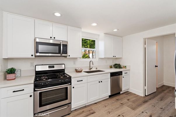 Interior, Kitchen, Recessed Lighting, Stainless Steel Appliances, Wood Texture Flooring