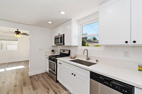 Interior, Kitchen, Recessed Lighting, Stainless Steel Appliances, Wood Texture Flooring