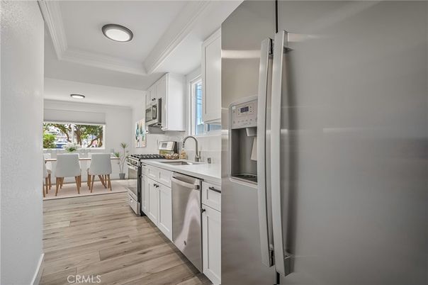 Dining room, Interior, Kitchen, Recessed Lighting, Stainless Steel Appliances, Wood Texture Flooring