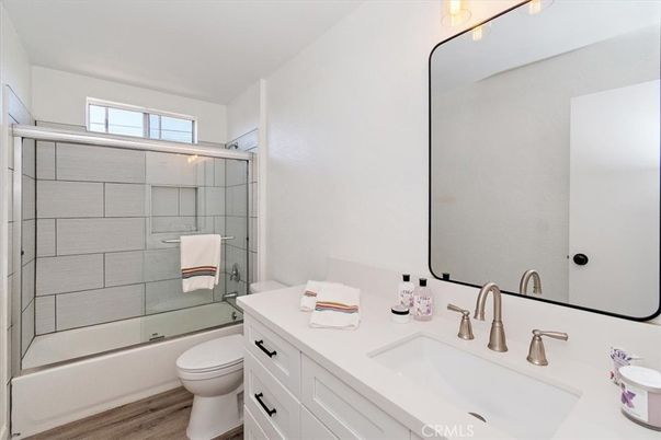 Bathroom, Dual Sink Vanities, Glass Shower, Interior, Wood Texture Flooring