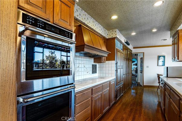 Interior, Kitchen, Recessed Lighting, Stainless Steel Appliances, Tile Countertops, Wood Texture Flooring